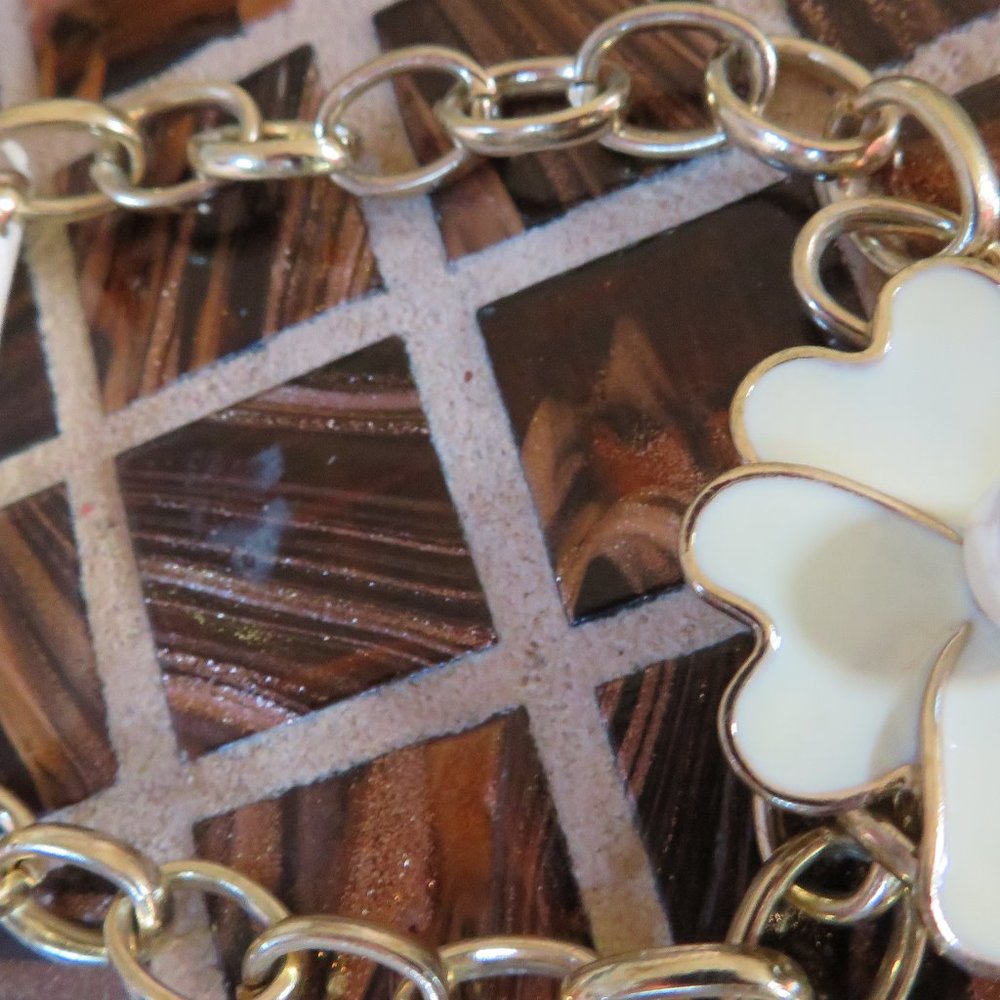 BRACELET- A FLOWER WITH PEARL AND A GOLD CHAIN